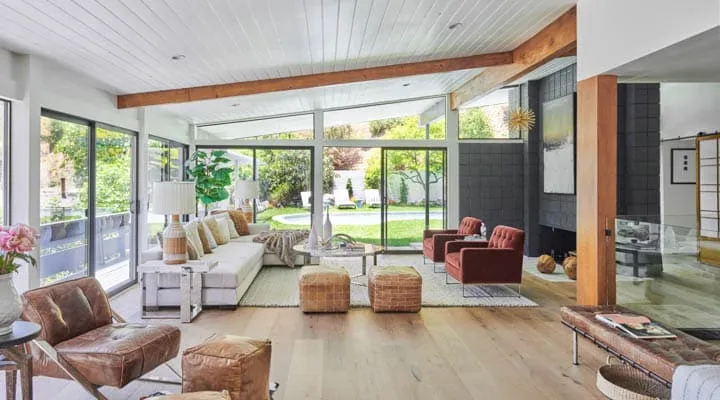 A living room filled with furniture and a fire place