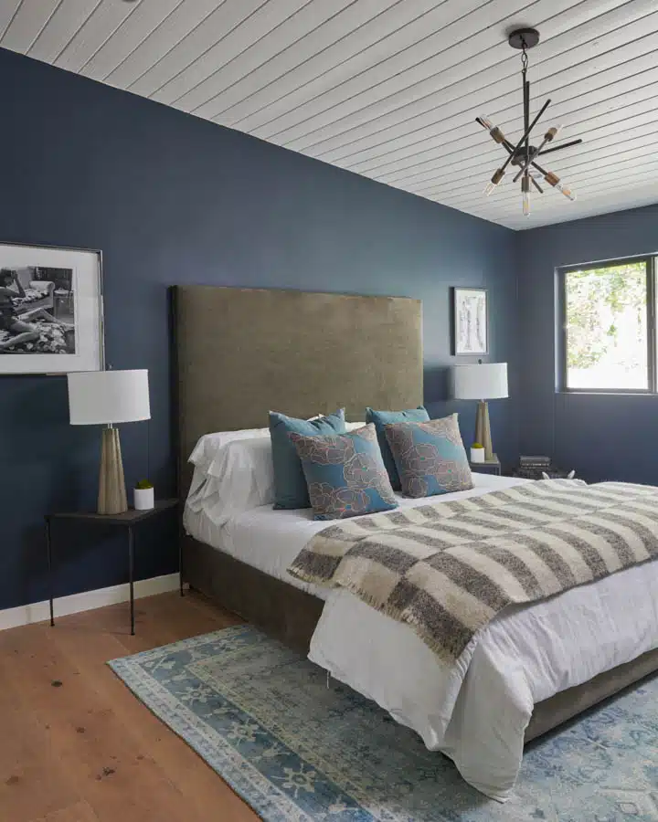 A bedroom with a large bed in a hotel room