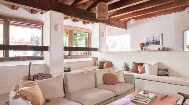 A living room filled with furniture and a large window