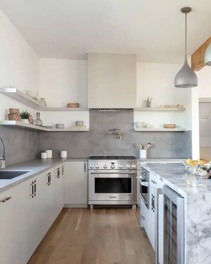 A large kitchen with stainless steel appliances and wooden cabinets