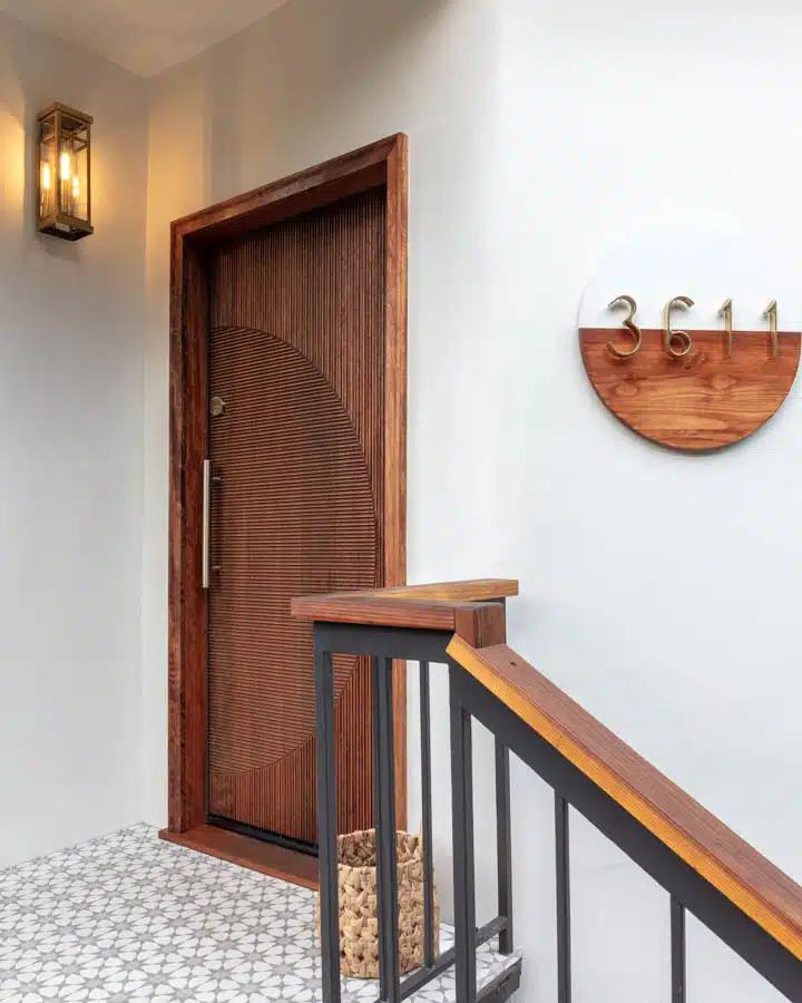 A bedroom with a wooden door