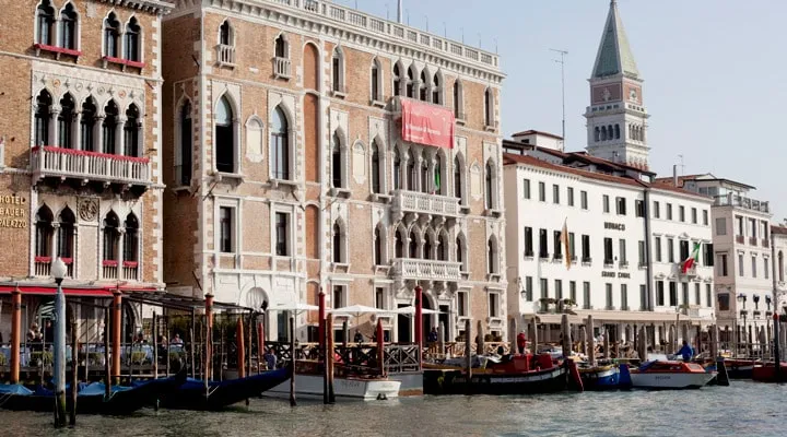 A boat is docked in front of a building