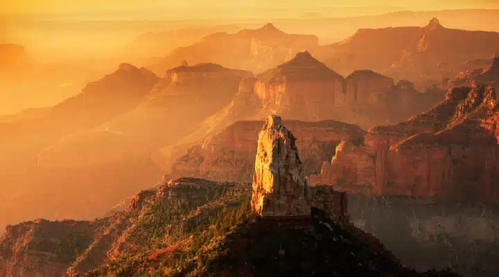 A canyon with a mountain in the background