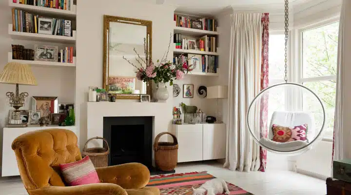 A living room filled with furniture and a fire place