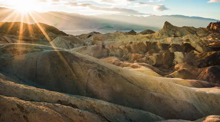 A canyon with a mountain in the background