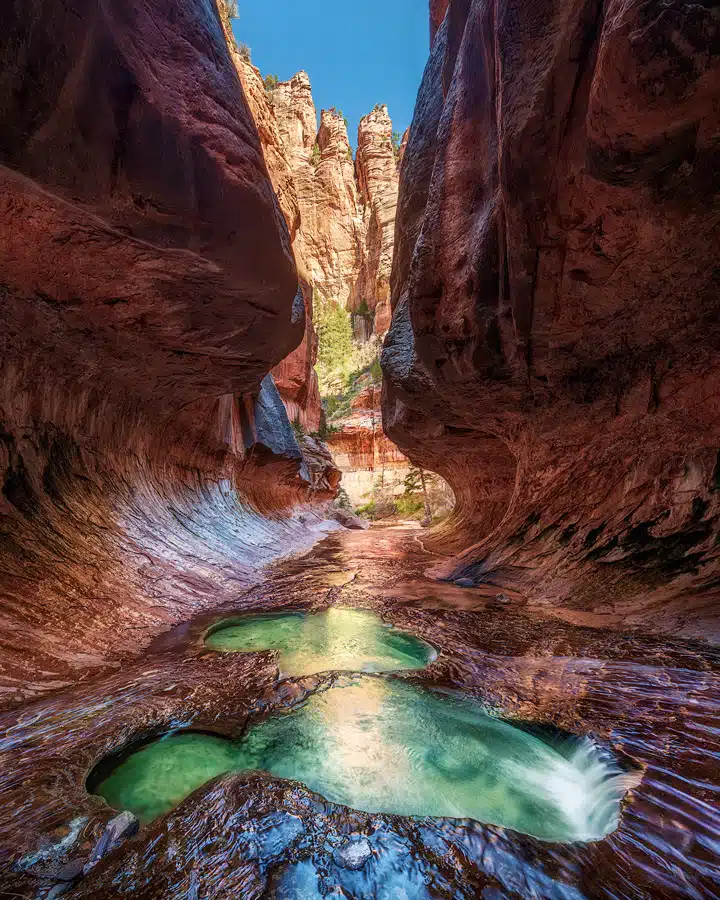 A canyon with a mountain in the background