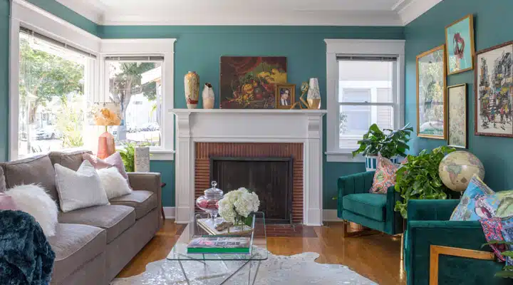 A living room filled with furniture and a fire place