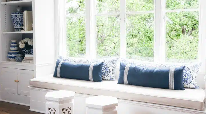 A living room filled with furniture and a large window