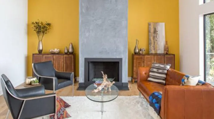 A living room filled with furniture and a fire place