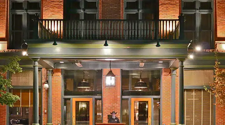 A fireplace in front of a brick building