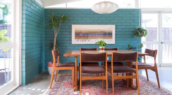 A dining room table in front of a window