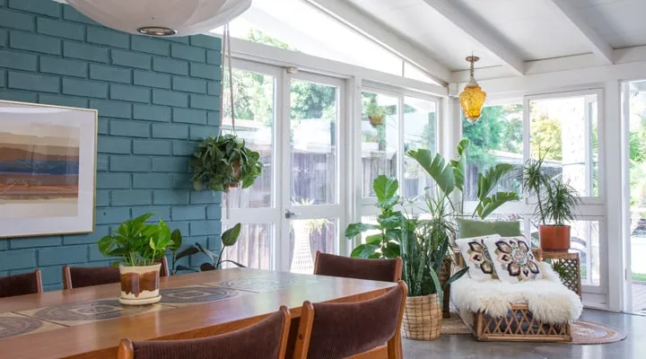 A dining room table in front of a window