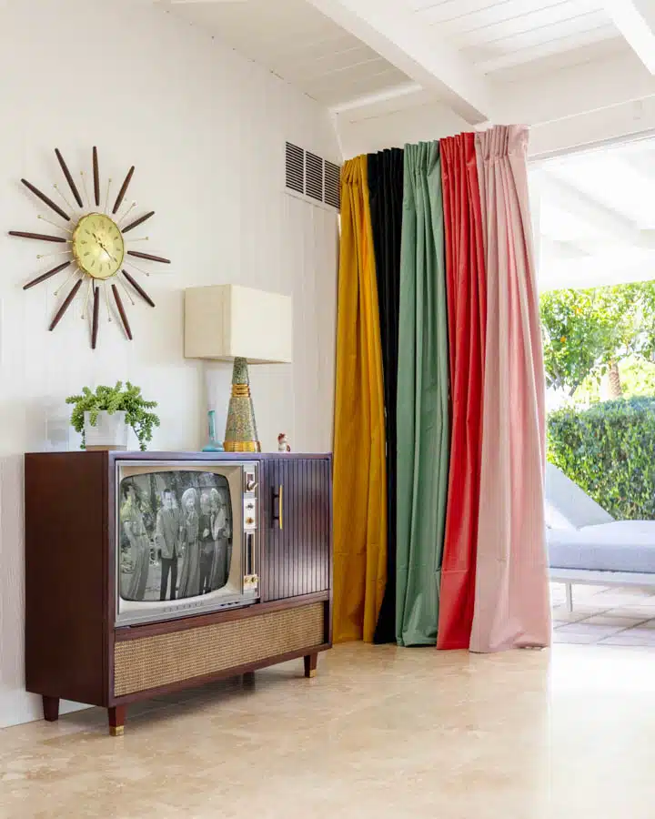 A living room filled with furniture and a curtain