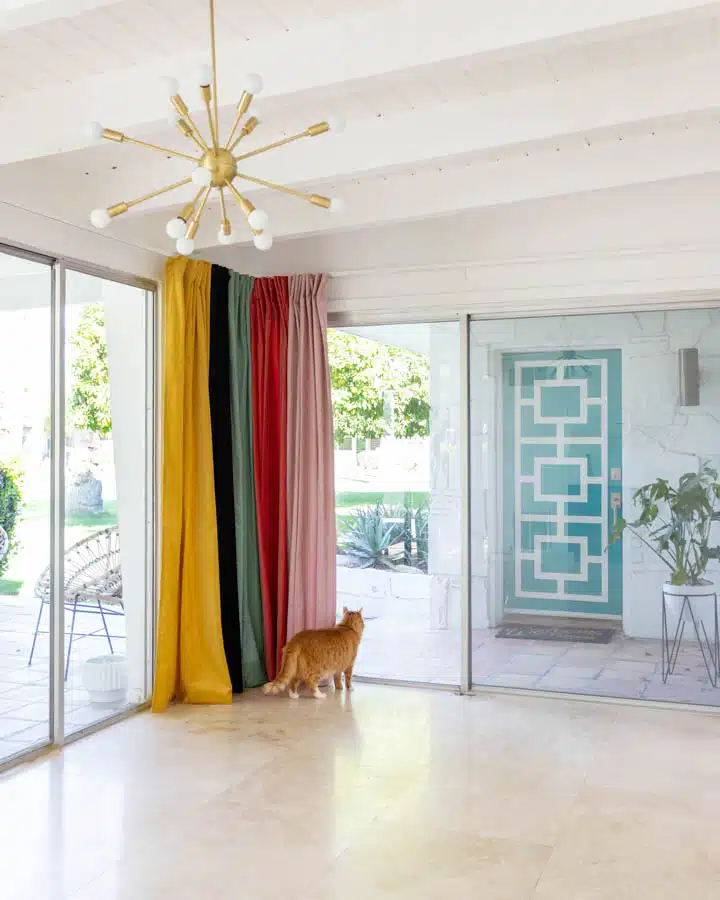 A living room filled with furniture and a large window
