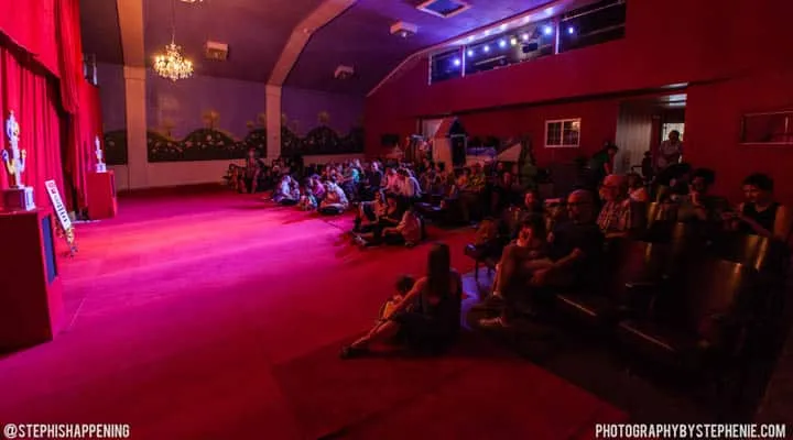 A group of people sitting at night