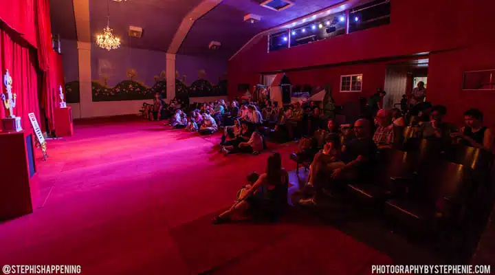 A group of people sitting at night