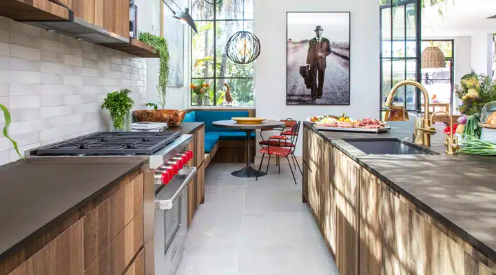 A kitchen with a table in front of a window