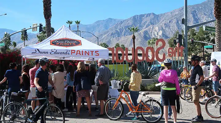 A group of people riding on the back of a bicycle