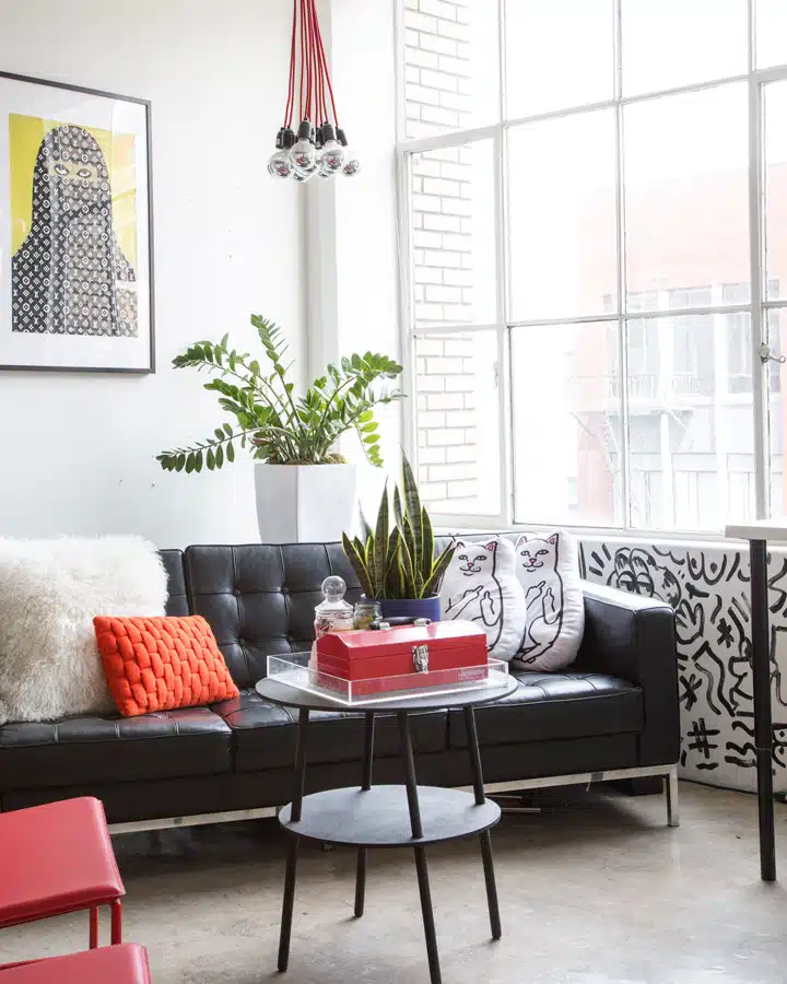 A living room filled with furniture and a large window