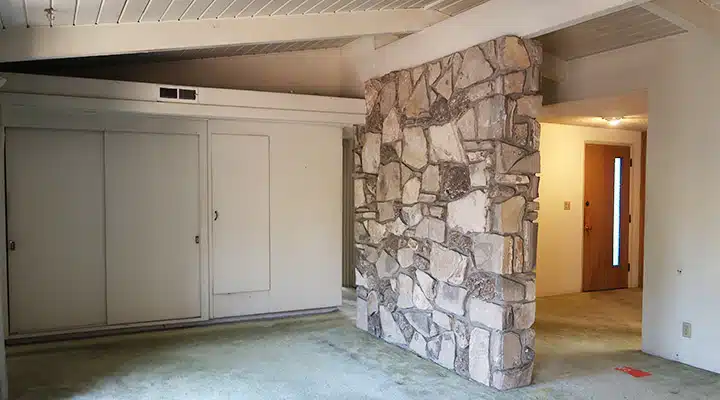 A kitchen with a stove top oven sitting inside of a building