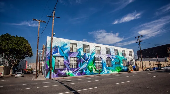 Colorful graffiti on the side of a road