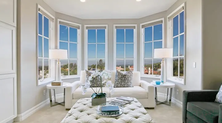 A living room filled with furniture and a large window