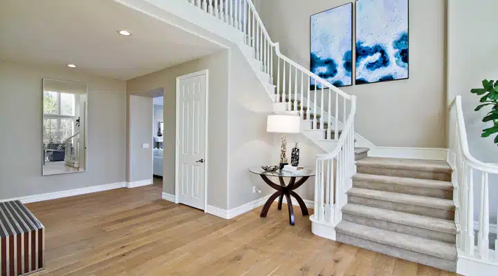 A living room filled with furniture on top of a hard wood floor