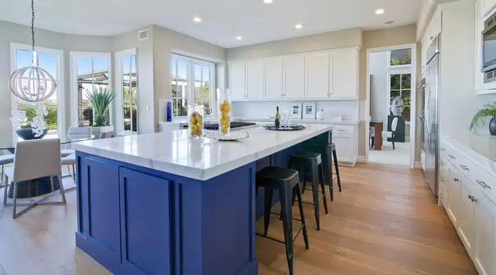 A kitchen with an island in the middle of a room