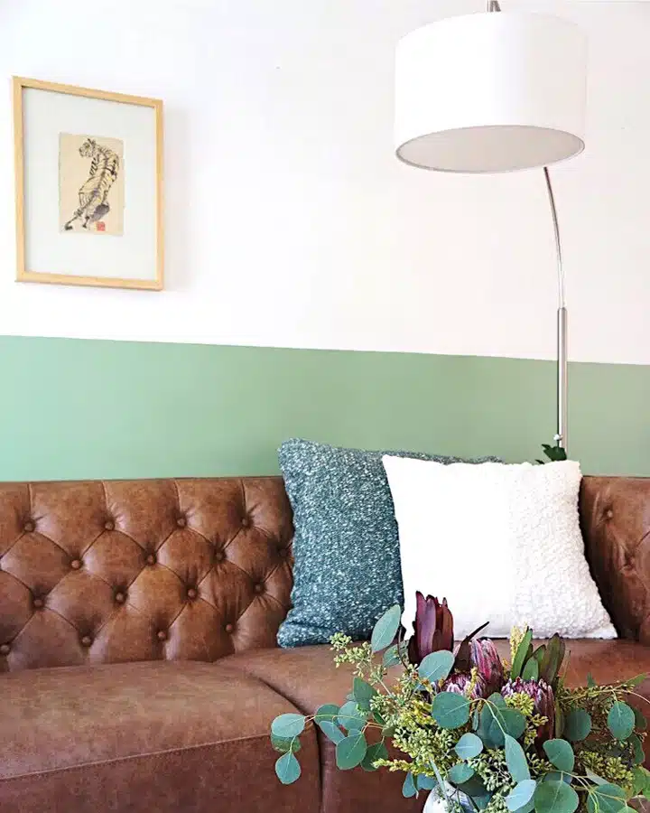 A brown leather couch in a living room