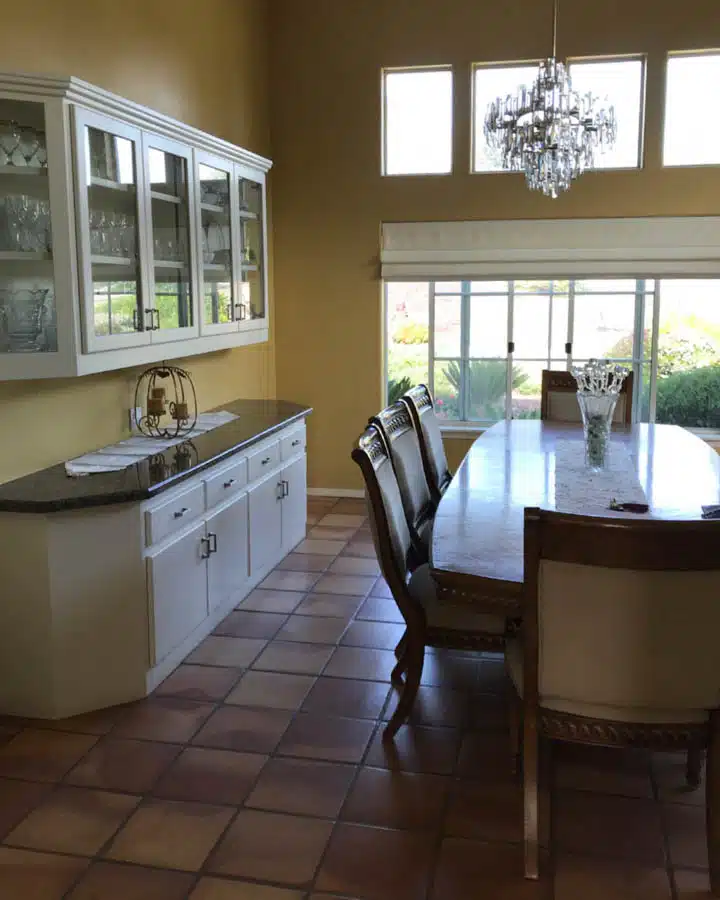 A living room filled with furniture and a large window