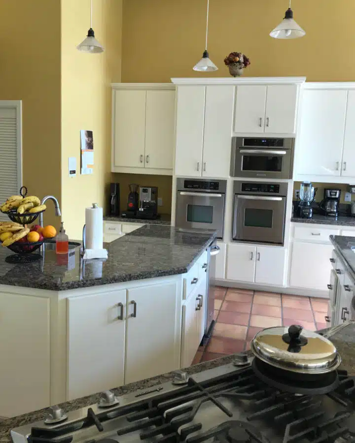 A kitchen with a stove and a sink