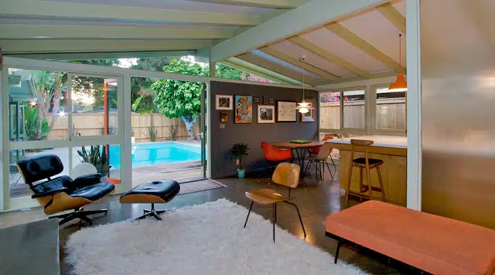 A living room filled with furniture and a large window