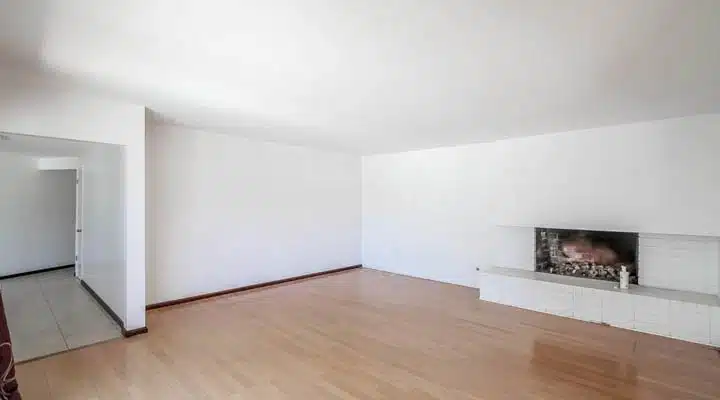 A kitchen with a wood floor