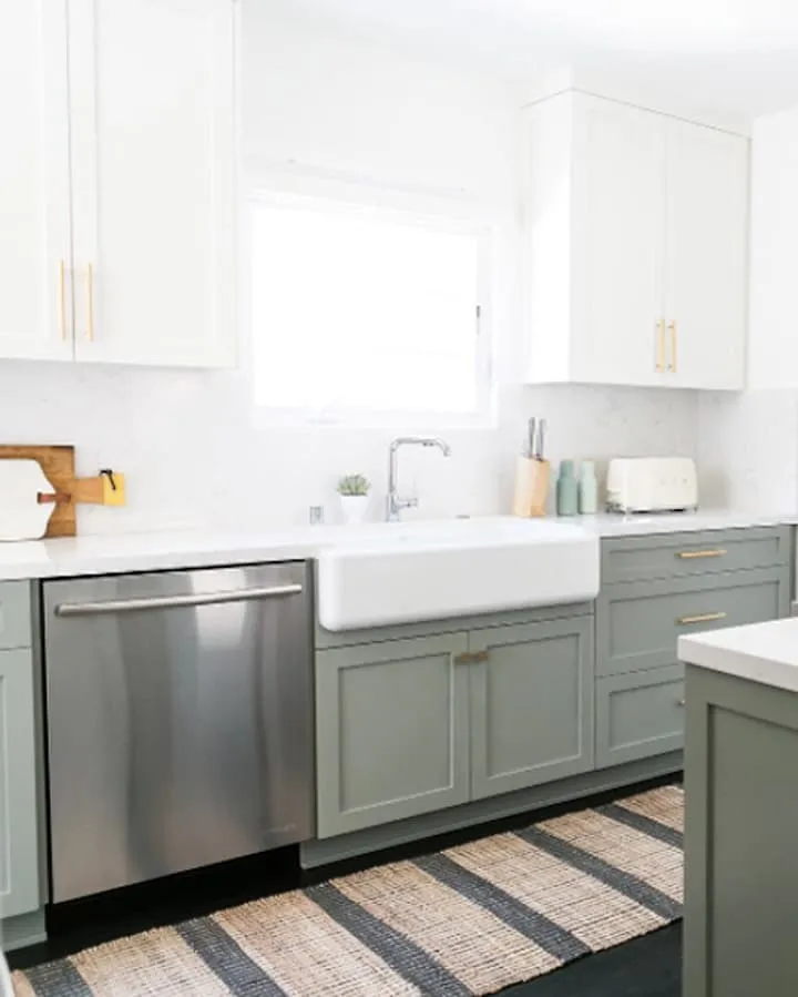 A kitchen with a sink and a microwave