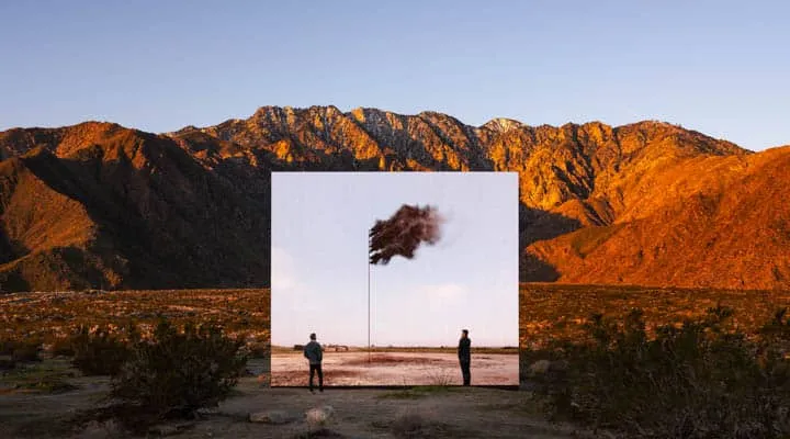 A person standing in front of a mountain