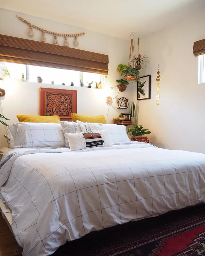 A bedroom with a large bed in a hotel room