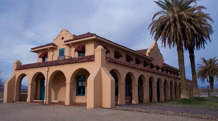 A large building with palm trees