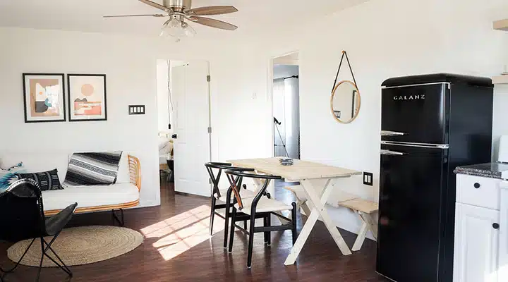 A kitchen with a dining room table