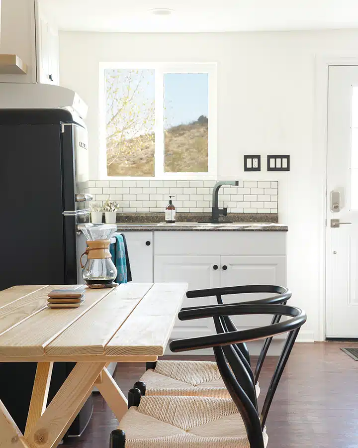 A kitchen with a dining room table