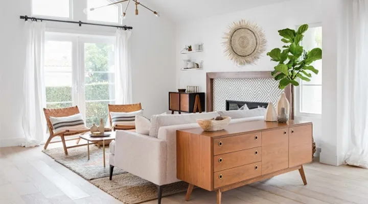 A living room filled with furniture and a large window