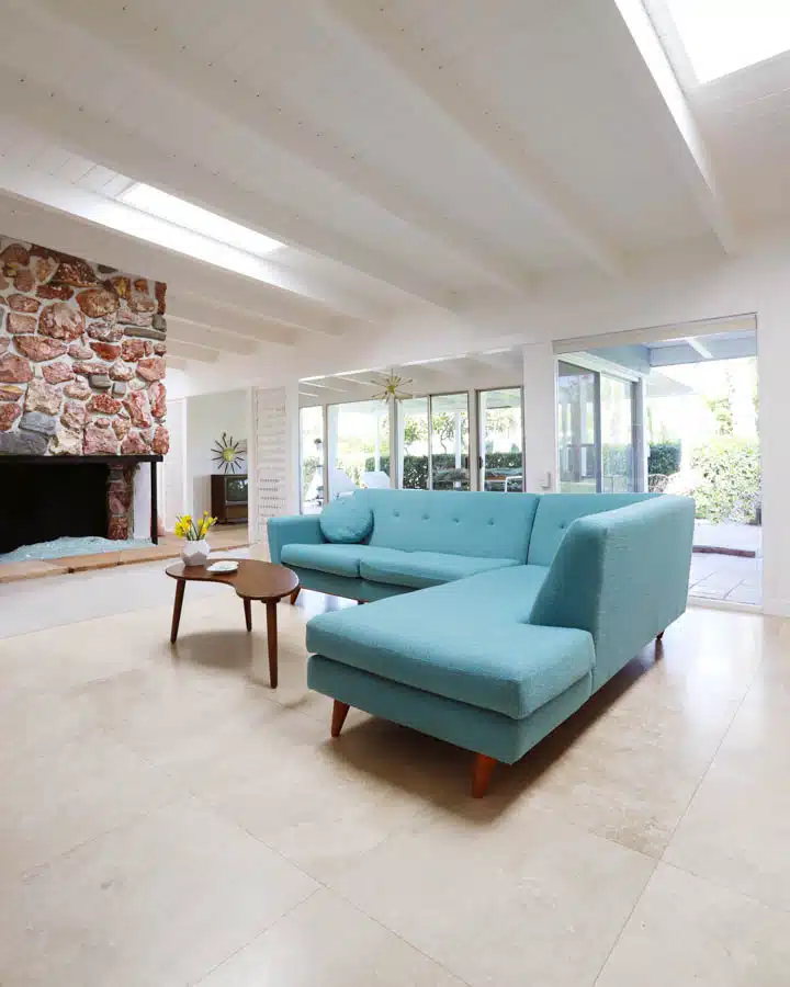 A living room filled with furniture and a large window