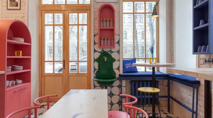 A dining room table in front of a window