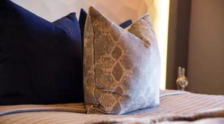 A bed with a blue blanket
