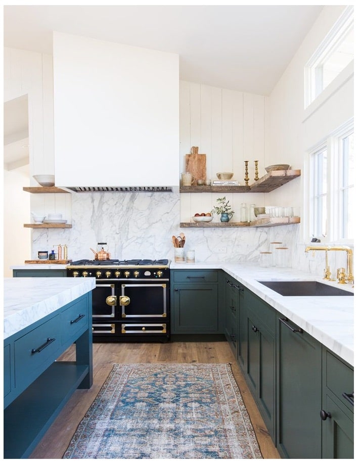 A kitchen with a building in the background
