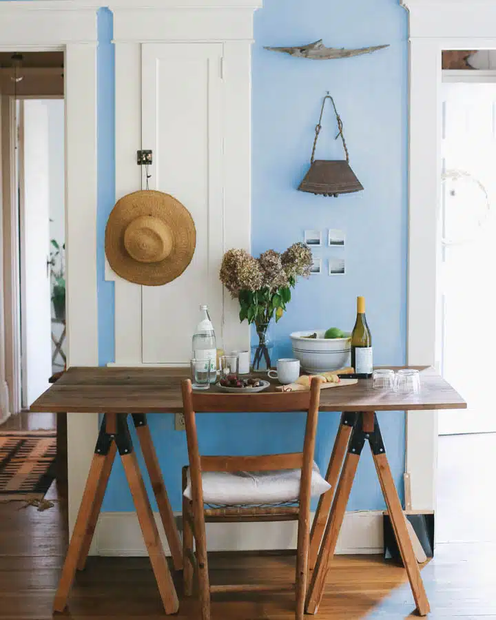 A room filled with furniture and vase on a table