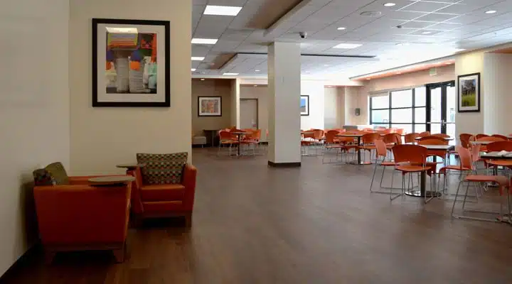 A living room filled with furniture and a wood floor