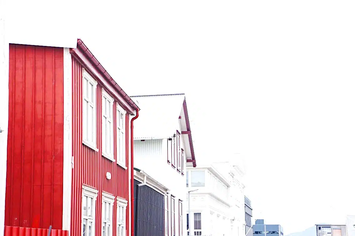 A train is parked on the side of a building