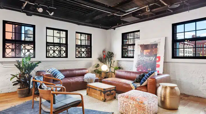 A living room filled with furniture and a fire place