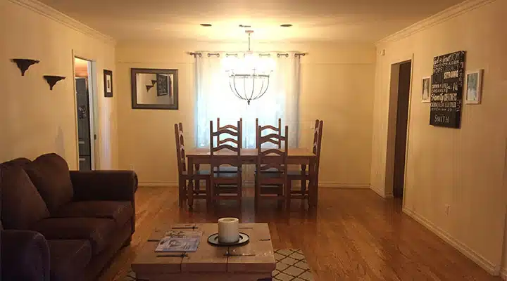 A living room filled with furniture and a table