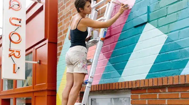 A woman standing in front of a building